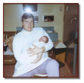 Andy in his father's arms on his date of birth, March 13th 1975