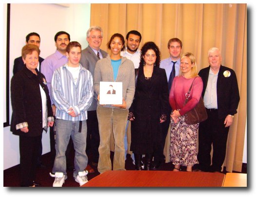 Group photo of Dr. Claude Laguë, the Moffitt family and five past recipients of Andy's scholarship